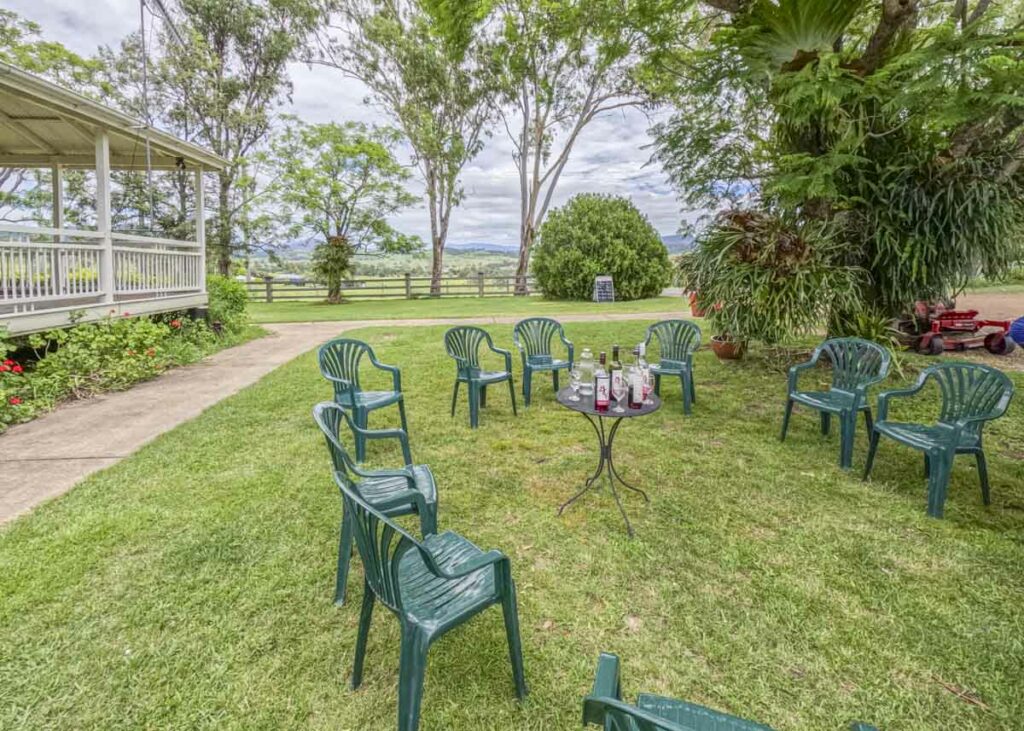 An outdoor wine tasting area under a big tree at one of the Boonah wineries